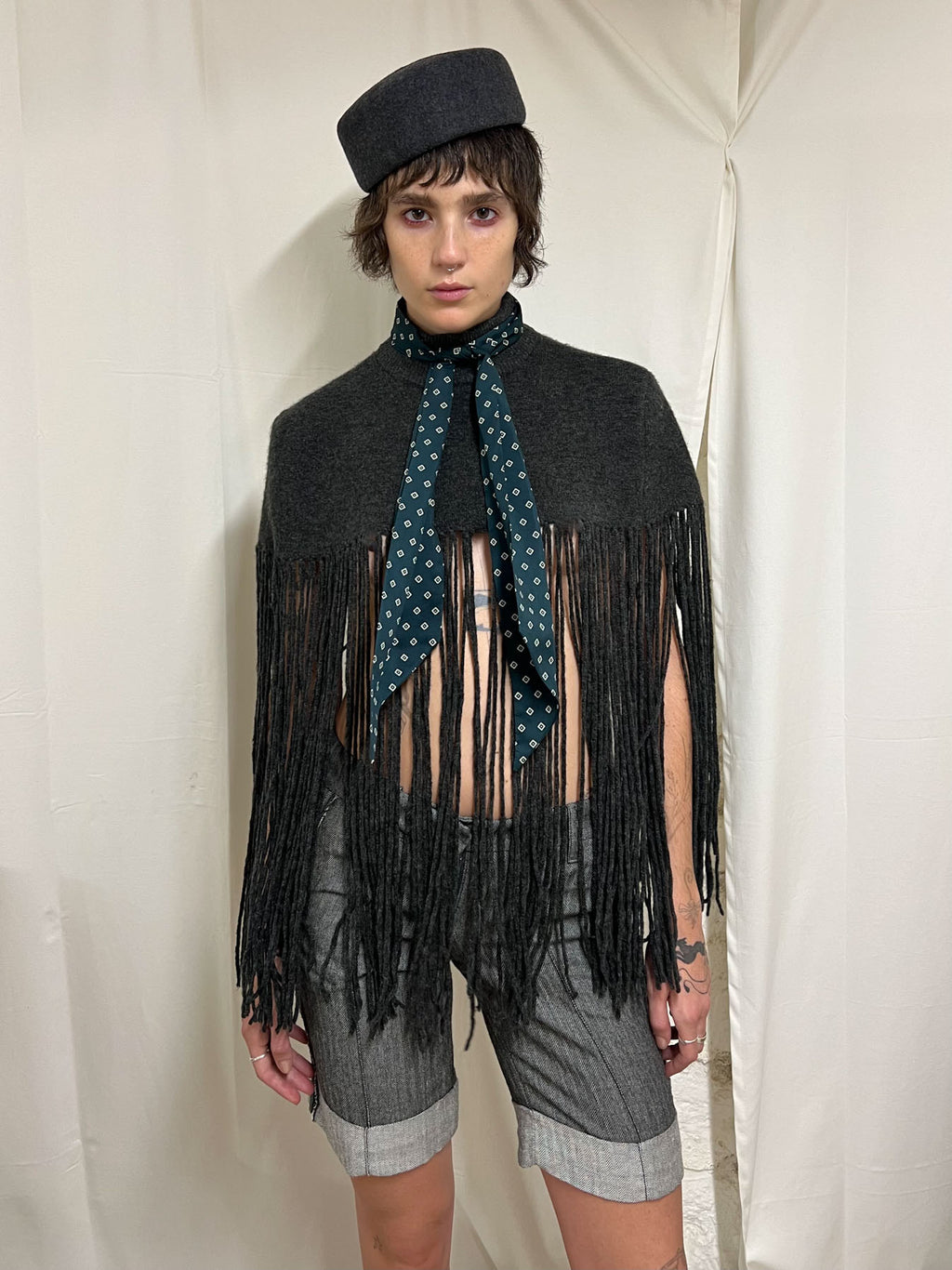 Grey fringed poncho
