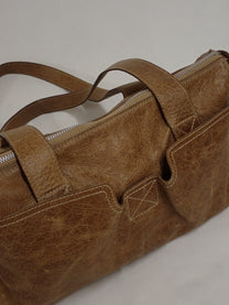Aged leather bag